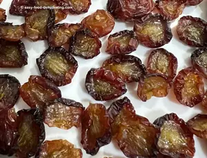 raisins from large red grapes on a white plate
