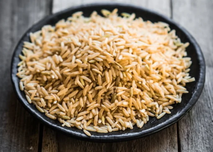 brown rice in a black bowl brown rice in a black bowl