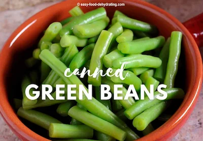 Cut green beans in a round red bowl