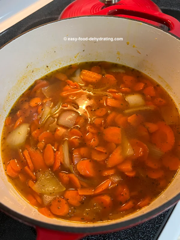 Carrot soup cooking on stove