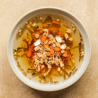 Clear broth with added dehydrated onion, garlic, and carrots