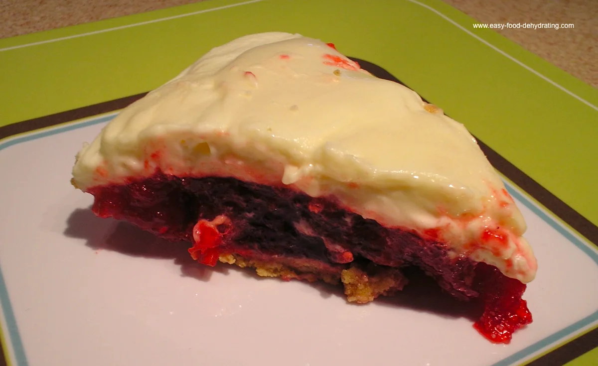 Cranberry and Pineapple Pie with Creamy Marshmallow Topping Slice of cranberry and pineapple pie topped with creamy marshmallow and whipped cream layer on a graham cracker crust