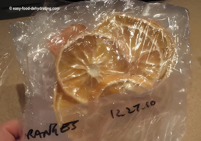 sliced dehydrated oranges in a sealed vacuum-sealer bag