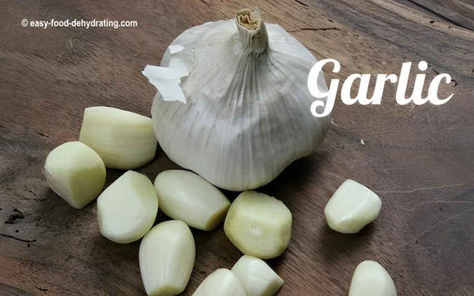 Garlic bulb with loose peeled cloves Garlic bulb with loose peeled cloves