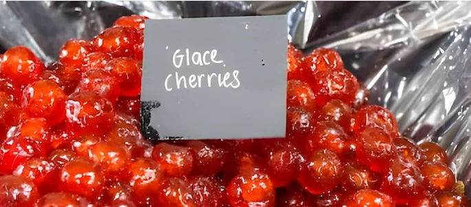 Glacé Cherries on top of a plastic sheet, at a local market Glacé Cherries on top of a plastic sheet, at a local market