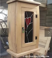 Wooden cabinet with stained glass by James Wooden cabinet with stained glass by James