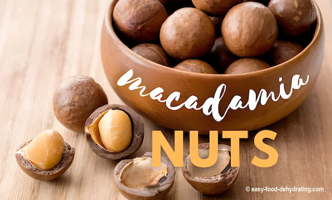 Macadamia nuts in a wooden bowl Macadamia nuts in a wooden bowl