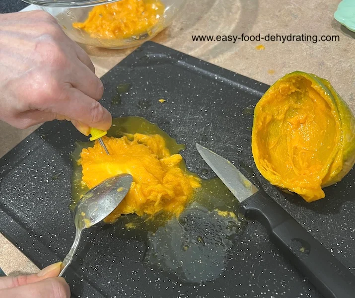 Use a corn on the cob spiky holder to hold slippery mango pit Use a corn on the cob spiky holder to hold slippery mango pit