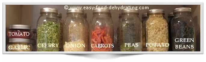 Mason jars in a row on a shelf, filled with dehydrated vegetables Mason jars in a row on a shelf, filled with dehydrated vegetables