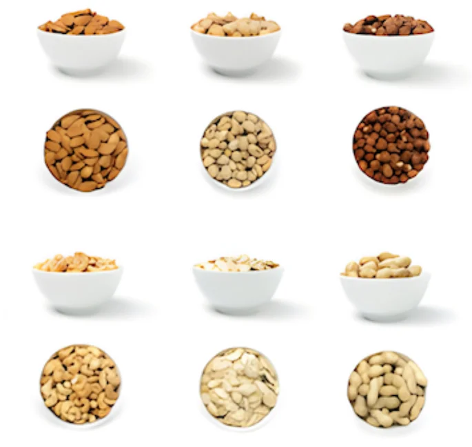 assorted nuts in bowls with their top views assorted nuts in bowls with their top views
