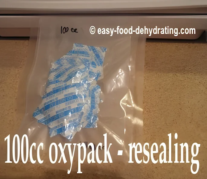 A package of 100cc oxygen absorbers is being resealed 100cc oxygen absorbers being re-vacuum sealed