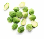 A pile of peeled Brussels Sprouts on a white background