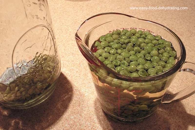Rehydrating peas in water, in a measuring jug