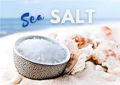 Sea salt in a bowl, on the beach Sea salt in a bowl, on the beach