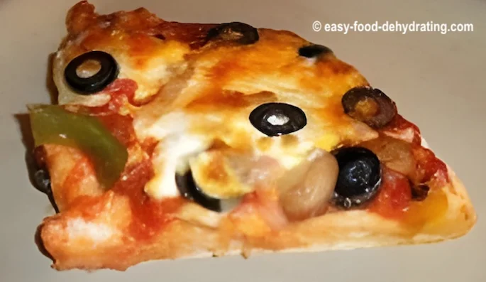 A slice of homemade pizza on a plate