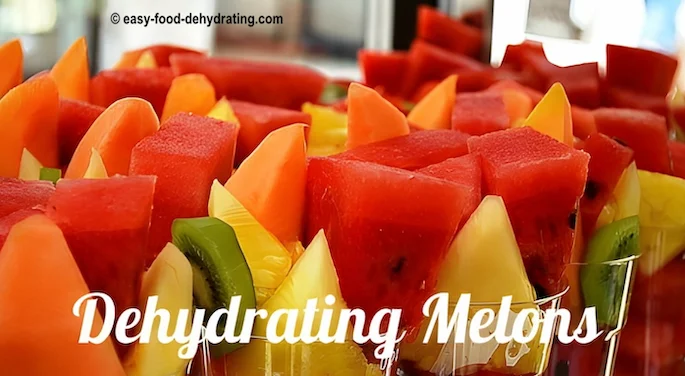 Watermelon, cantaloupe, pineapple, and kiwi in clear glasses Watermelon, cantaloupe, pineapple, and kiwi in clear glasses