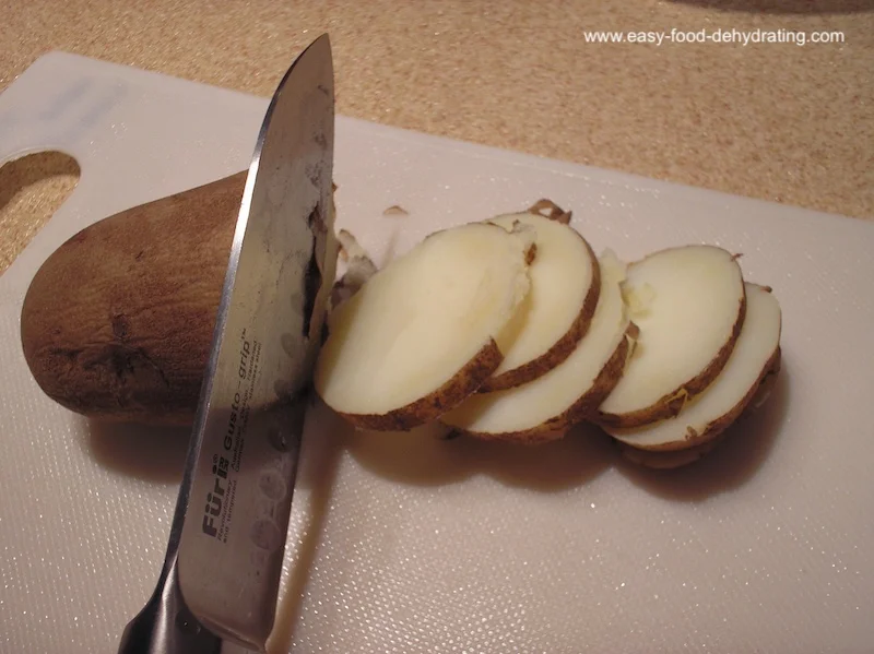 Cooked (and chilled) potatoes being sliced Easy slicing of chilled, cooked potatoes