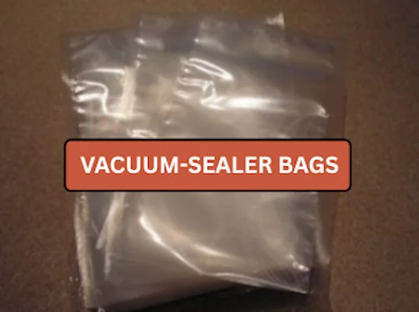 Clear vacuum-sealer bags stacked on a kitchen counter