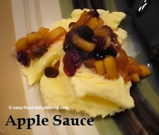 Apple sauce atop vanilla ice cream in a bowl
